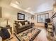 Living room features hardwood floors, a fireplace, and a large window at 824 S Nelson Way, Lakewood, CO 80226