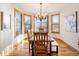 Bright dining room with wood table and large windows at 16226 River Haven Way, Morrison, CO 80465