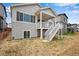 Two-story house with backyard deck and stairs at 13351 E 100Th Pl, Commerce City, CO 80022