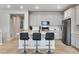 Modern kitchen with white cabinets, stainless steel appliances and an island at 13351 E 100Th Pl, Commerce City, CO 80022