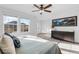 Main bedroom with large windows, mountain art, and a crib at 17917 E 103Rd Ave, Commerce City, CO 80022