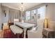 Farmhouse-style dining room with rustic table and chandelier at 2394 S Loveland Way, Lakewood, CO 80228