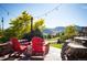 Stone patio with red chairs and mountain views at 2394 S Loveland Way, Lakewood, CO 80228