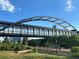 Modern pedestrian bridge with metal frame at 10111 Inverness Main St # 223, Englewood, CO 80112