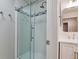 Updated bathroom with glass shower door and modern vanity at 6475 Orion Way, Arvada, CO 80007