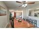 Dining area with hardwood floors, and view into living room at 6475 Orion Way, Arvada, CO 80007