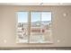 Bedroom with large windows offering scenic mountain views at 12983 W Ida Ave # 313, Littleton, CO 80127
