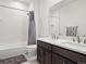 Shared bathroom with double vanity and a shower/tub combo at 3051 Newfound Lake Rd, Berthoud, CO 80513