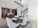 Open concept dining room with kitchen and staircase views at 3051 Newfound Lake Rd, Berthoud, CO 80513