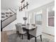 Spacious dining area with hardwood floors and large windows at 3051 Newfound Lake Rd, Berthoud, CO 80513