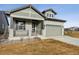Two-story house with front porch and attached garage at 3051 Newfound Lake Rd, Berthoud, CO 80513