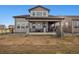 Two-story house exterior featuring stone accents and a covered patio at 3051 Newfound Lake Rd, Berthoud, CO 80513