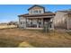 Two-story house exterior with stone accents and a covered patio, showcasing a modern design at 3051 Newfound Lake Rd, Berthoud, CO 80513