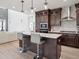 Open concept kitchen with island and breakfast bar at 3051 Newfound Lake Rd, Berthoud, CO 80513