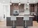 Modern kitchen with island and stainless steel appliances at 3051 Newfound Lake Rd, Berthoud, CO 80513