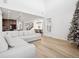Bright living room features a sectional sofa and kitchen view at 3051 Newfound Lake Rd, Berthoud, CO 80513