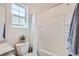 Bathroom with a bathtub, shower, and neutral color scheme at 17909 E 103Rd Ave, Commerce City, CO 80022