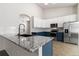 Spacious kitchen with granite countertops and stainless steel appliances at 1063 Halfmoon Dr, Castle Rock, CO 80104