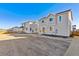 Two-story home with gray siding and a large backyard at 4591 Boone Cir, Brighton, CO 80601