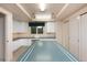 Bright basement office with built-in cabinetry and workspace at 160 Ponderosa Dr, Boulder, CO 80303