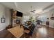 Spacious living room with fireplace, hardwood floors and ample seating at 5069 Castle Pines S Dr, Castle Rock, CO 80108