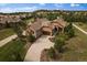 Luxury home with a large driveway, aerial view at 5069 Castle Pines S Dr, Castle Rock, CO 80108