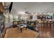 Open concept living room and kitchen with hardwood floors and fireplace at 5069 Castle Pines S Dr, Castle Rock, CO 80108