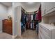 Large walk-in closet with ample shelving and drawers at 5069 Castle Pines S Dr, Castle Rock, CO 80108