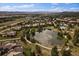 Community overview featuring a lake, homes, and walking paths at 5069 Castle Pines S Dr, Castle Rock, CO 80108