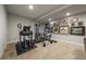 Basement home gym with various exercise equipment at 5069 Castle Pines S Dr, Castle Rock, CO 80108