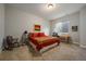 Finished basement bedroom with desk and rocking chair at 5069 Castle Pines S Dr, Castle Rock, CO 80108