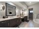 Spa-like bathroom with double vanity and a large soaking tub at 5069 Castle Pines S Dr, Castle Rock, CO 80108