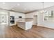 Modern kitchen with island, stainless steel appliances, and ample cabinet space at 24513 E 36Th Ave, Aurora, CO 80019