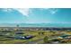 Panoramic aerial view of the community, showing homes, open space and mountains at 24513 E 36Th Ave, Aurora, CO 80019