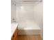 Bathroom features a shower/tub combo and speckled countertop at 10243 E Peakview Ave # A103, Englewood, CO 80111