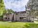 Two-story condo building with balconies and green lawn at 10243 E Peakview Ave # A103, Englewood, CO 80111