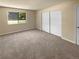 Bright bedroom with neutral carpeting and large closet at 10243 E Peakview Ave # A103, Englewood, CO 80111