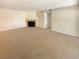 Living room features a fireplace and carpet flooring at 10243 E Peakview Ave # A103, Englewood, CO 80111