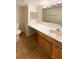 Bathroom with vanity, sink, and shower/tub combination at 10243 E Peakview Ave # A103, Englewood, CO 80111