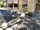 Building exterior with landscaping and a gravel pathway at 10243 E Peakview Ave # A103, Englewood, CO 80111