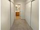 Hallway with access to bathroom and bedroom closets at 10243 E Peakview Ave # A103, Englewood, CO 80111