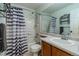 Clean bathroom with shower/tub combo and wood vanity at 9551 Longford Way, Parker, CO 80134