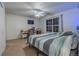 Bright bedroom with a king-size bed and built-in desk space at 9551 Longford Way, Parker, CO 80134