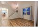 Light and airy living room with hardwood floors and a staircase at 9551 Longford Way, Parker, CO 80134