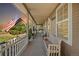 Front porch with seating and American flag at 32401 E 147Th Ave, Brighton, CO 80603