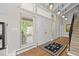 Elegant entryway with hardwood floors, double doors and access to staircase at 560 Front Range Rd, Littleton, CO 80120