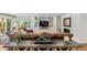 Bright living room features built-in shelving, fireplace and access to backyard at 560 Front Range Rd, Littleton, CO 80120