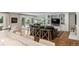 Living room with hardwood floors, built-in shelving, and comfortable seating at 560 Front Range Rd, Littleton, CO 80120