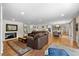 Open floor plan showcases spacious living room, kitchen and dining area at 560 Front Range Rd, Littleton, CO 80120