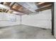 Unfinished basement with concrete floor and exposed beams at 1225 Baker St, Longmont, CO 80501